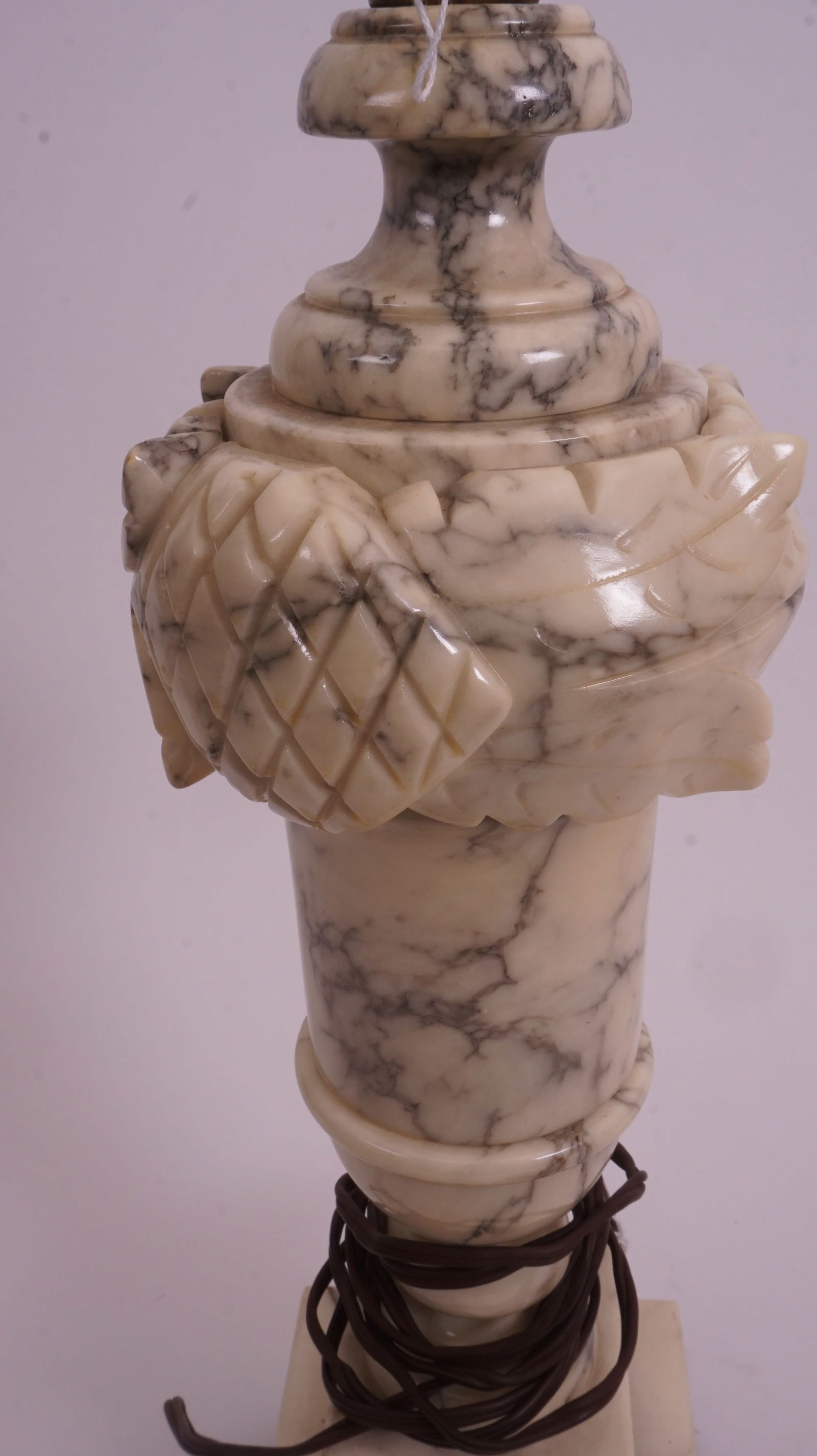 Carved Alabaster Table Lamp: Carved alabaster table lamp with classical profile, giving a soft warm glow when lit.