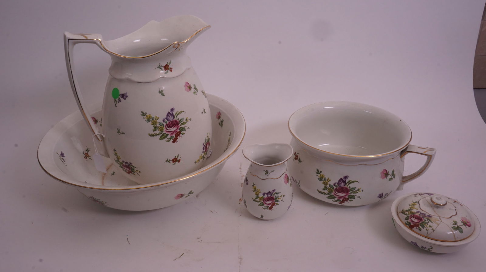 Victorian Pitcher & Bowl Set: Victorian porcelain pitcher and bowl wash set with additional pieces, ideal for bedroom or bath display.