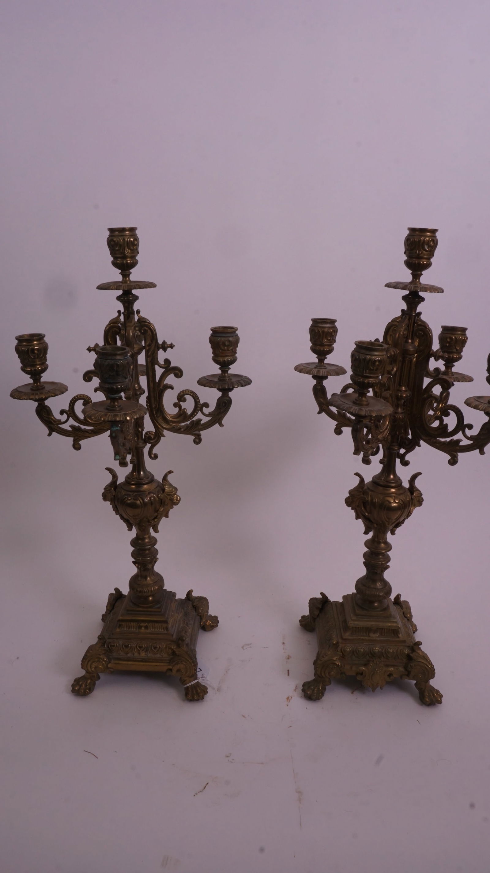 Pair Victorian Brass Candelabras: Pair of Victorian brass candelabras with multiple arms, 22 inches high, richly detailed.