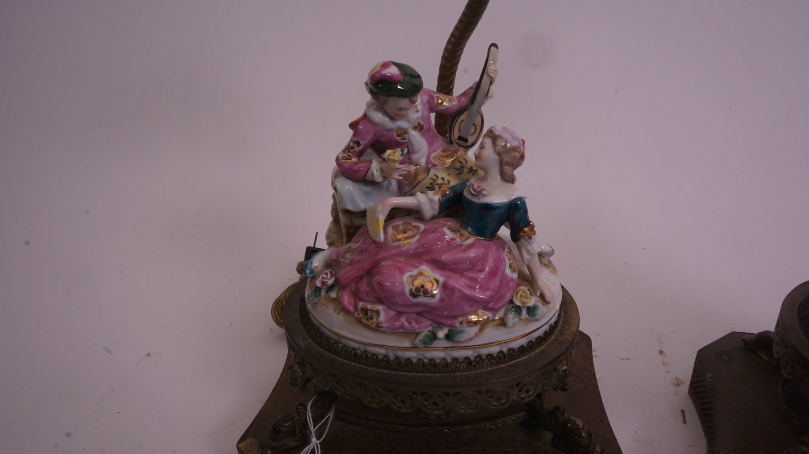 Dresden Porcelain Lamps: Pair of Dresden porcelain lamps with floral decoration and gilt accents, 19 inches high.