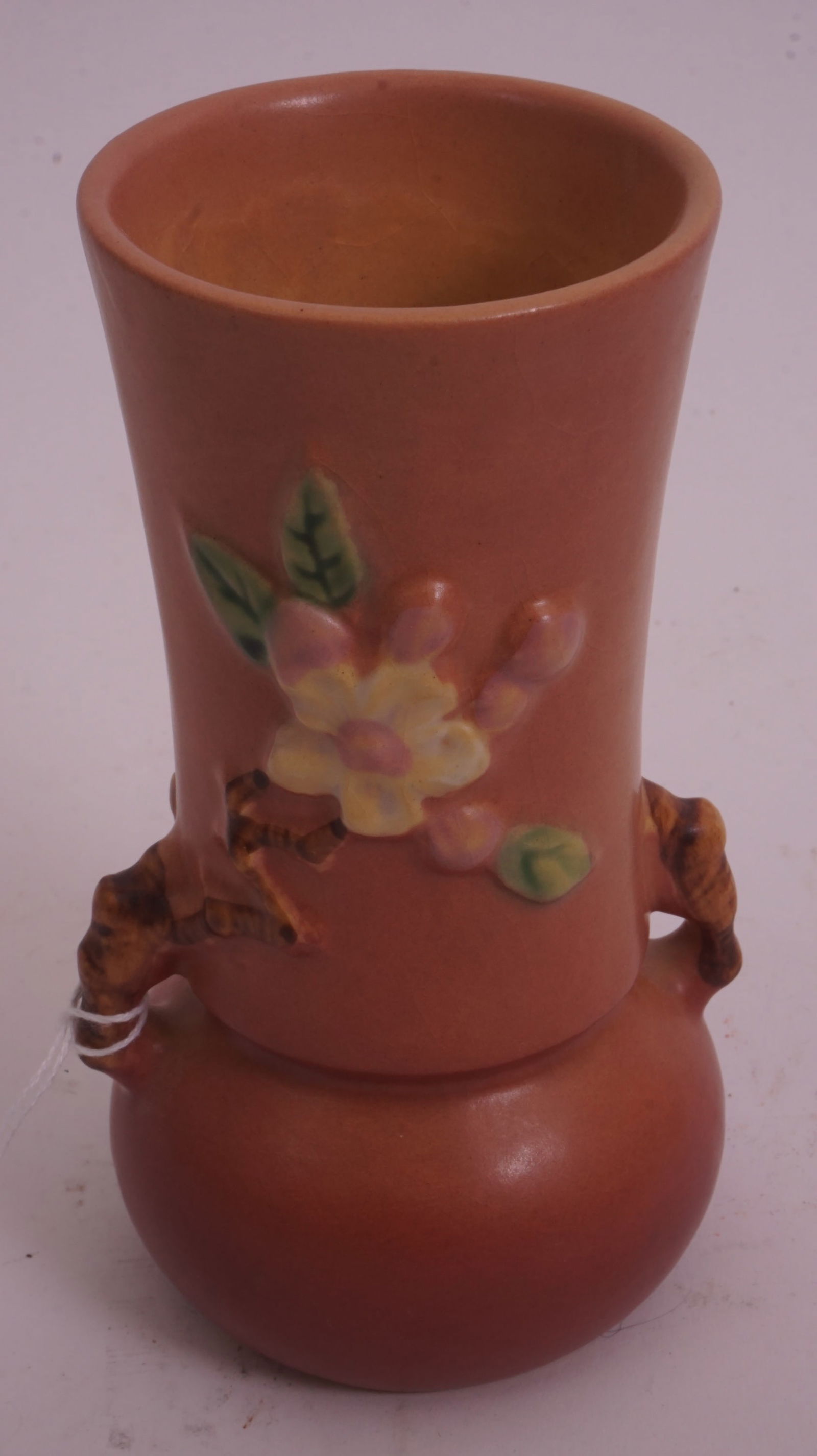 Roseville – Pink Apple Blossom 381-6: Roseville Pottery Apple Blossom vase in pink glaze, form 381-6, with raised floral branches.