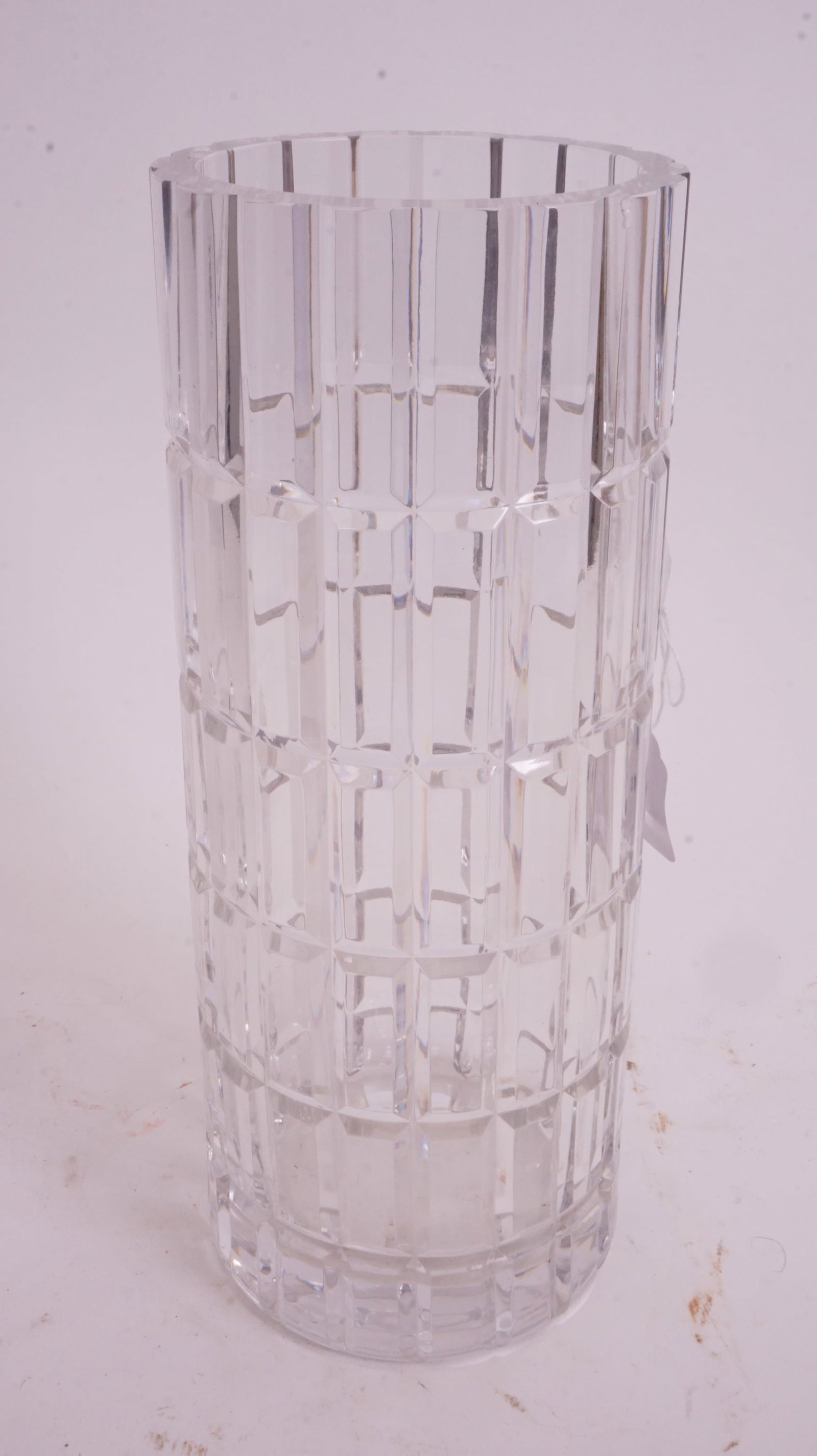 Cartier Cut Glass Crystal Vase: Cartier signed cut-glass cylindrical crystal vase with faceted sides.