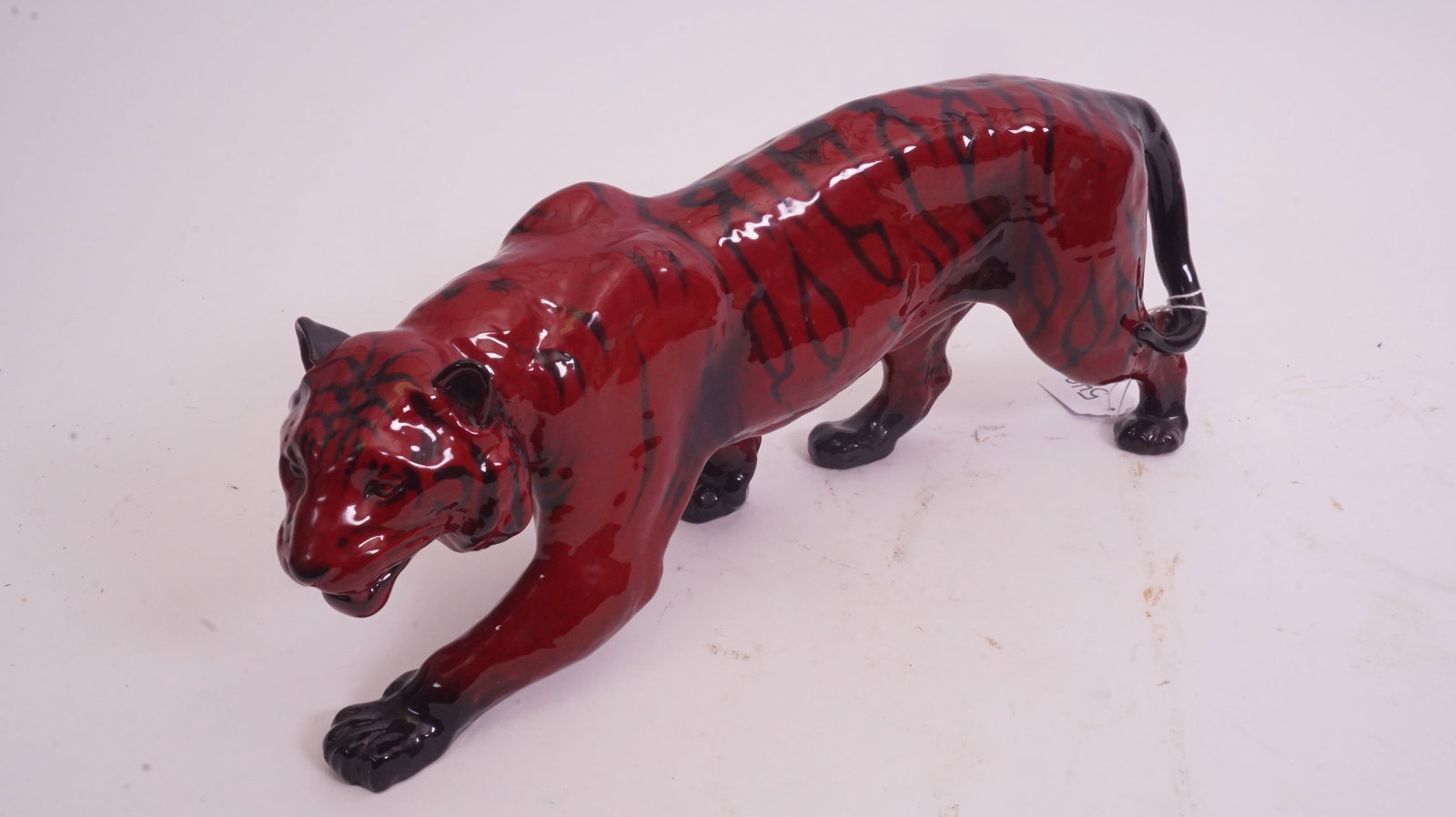 Royal Doulton Flambé Large Tiger: Large Flambé tiger figurine with prowling stance and intense red glaze.