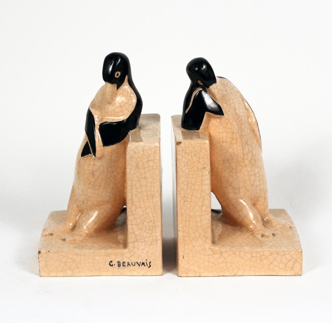 A ceramic pair of bookends G. Beauvais Made in France: A ceramic pair of bookends with penguins in crackle glaze by G. Beauvais, for KAZA edition. Made in France Circa: 1930 stamped on the underside "Made in France", inscribed KAZA edition, 8.50" 4.75" x 