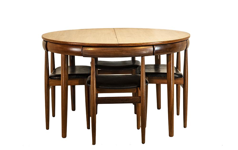 Hans Olsen for Frem Rojle Mobelfabrik table and chairs: Hans Olsen for Frem Rojle Mobelfabri, dining table and four chairs, Denmark, 1960s, teak top, teak base and chairs, black vinyl, stamped "Frem Rojle Made in Denmark", one 20" self-storing folding leaf