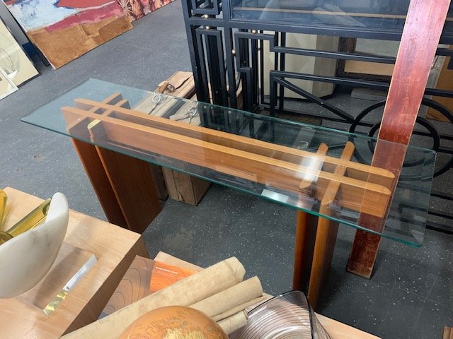 Gustav Gaarde Teak Console Table for Trekanten: Gustav Gaarde Console Table for Trekanten, Denmark. Teak and Glass. Base disassembles. 28"h x 60"w x 16"d. One small piece of missing veneer on top. Scratches to glass. Stamped "Made in Denmark."