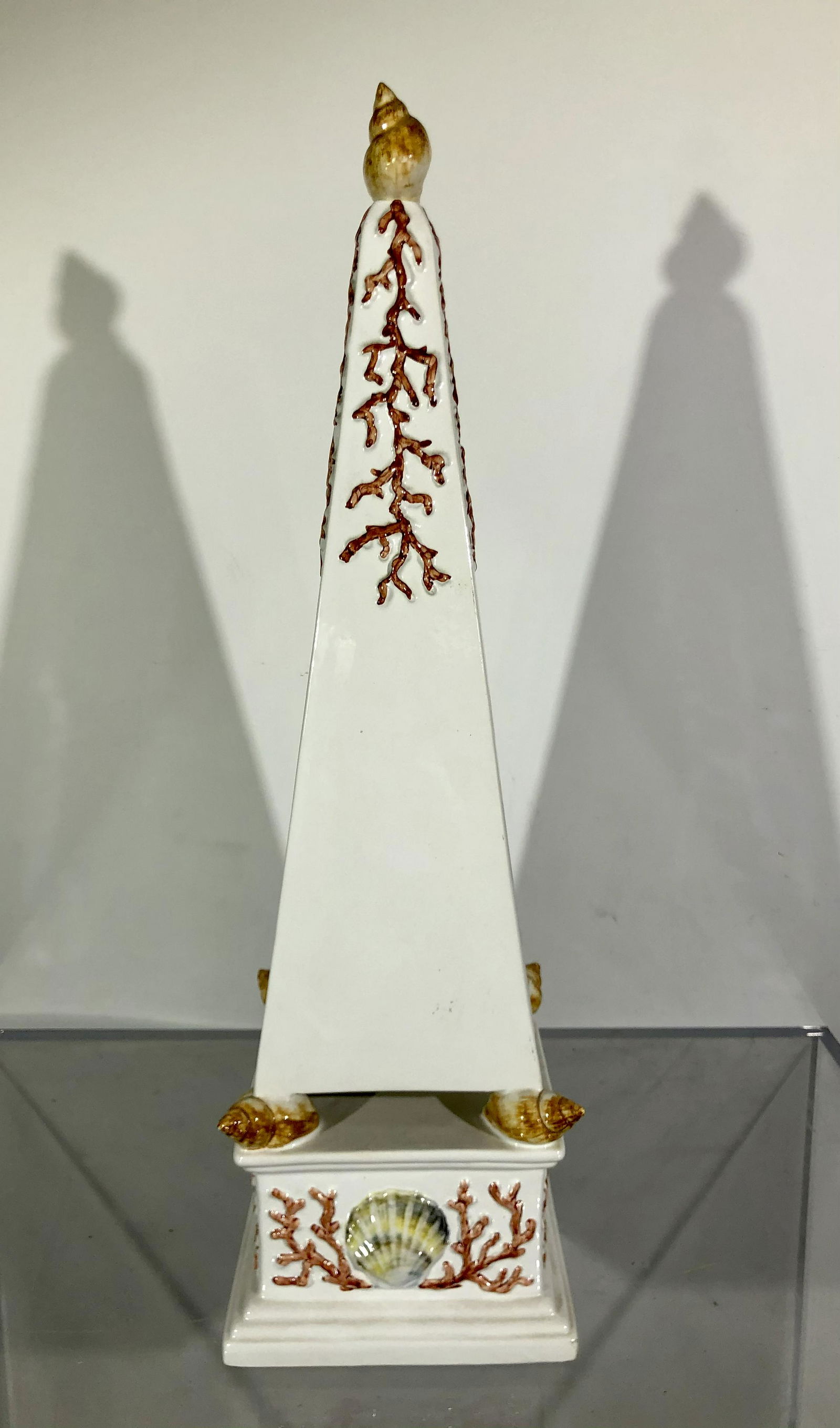 Meiselman Ceramic Obelisk Coral and Shells, Italy: Meiselman Mid-Century Modern Ceramic Obelisk Coral and Shells, signed Meiselman Made in Italy. 6" x 6" x 21.5". Roughness/minor chips to tips of three of the shells at the bottom corners.