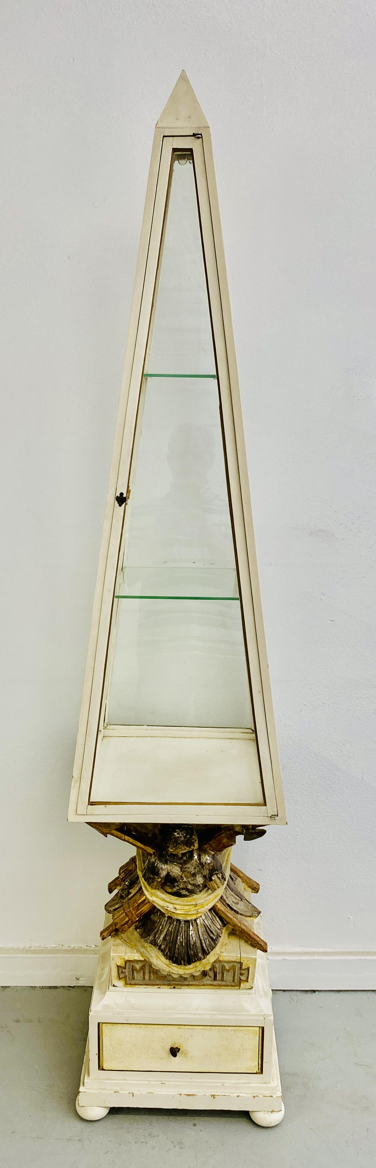 Italian Obelisk Vitrine from "Auntie Mame": Italian Obelisk Vitrine 74H x 15W x 15DFeatured in the opening party scenes near the buffet table.