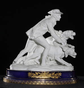 19th C Sèvres Two-Part Figure of a Hunter w/Dogs: 19th Century Sèvres Two-Part Figure of a Hunter with Dogs. Dimensions: 15" long, 15" high.