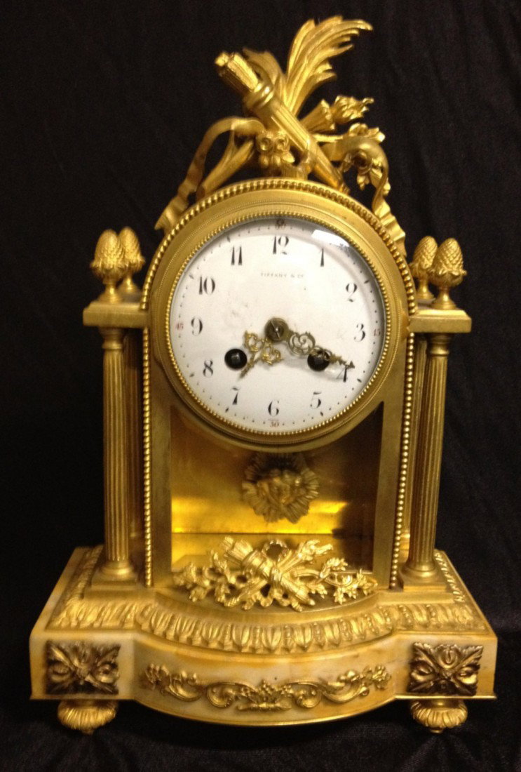 19th C Gilt Bronze/Marble Clock, Tiffany & Co.: 19th Century Gilt Bronze and Marble Clock, signed Tiffany & Co. Dimensions: 14" high , 8.5" x 4" (base)