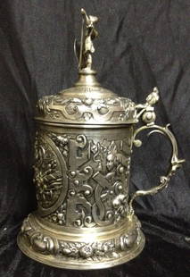 18th C Silvered Tankard w/Fine Fig/Floral Chasings: 18th Century Silvered Tankard with Fine Figural & Floral Chasings, Gilt washed interior. With hallmarks. Dimensions: 8" H, 5.5" (wide with handle) 4.5" diameter at base