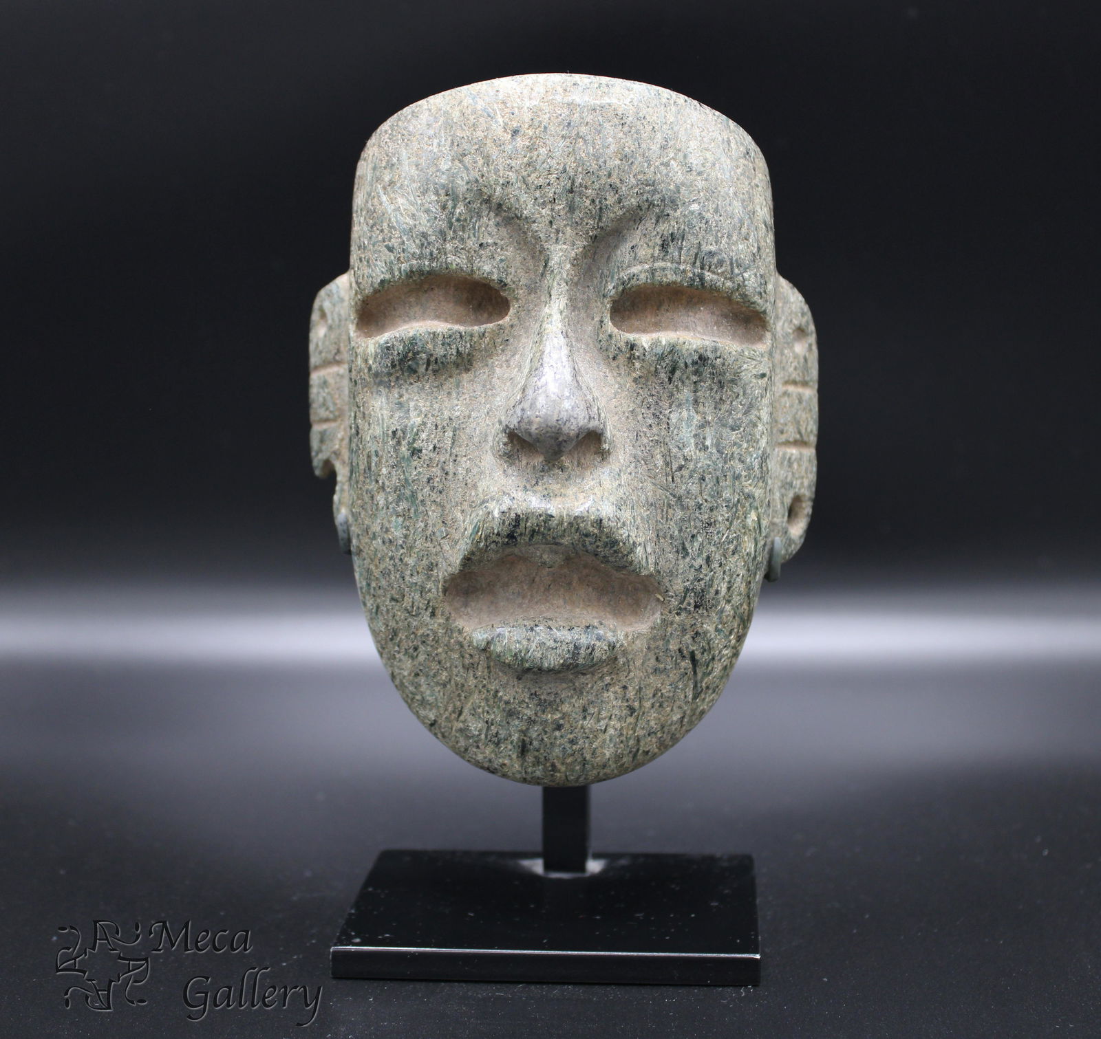 Olmec Serpentine Mask (900 BC - 600 BC): Olmec Serpentine Mask (900 BC - 600 BC) The mix of mica in the serpentine catches the light in this late Olmec mask. The soft curve to the eyes gives this mask a very human feel. Early Olmec masks wer