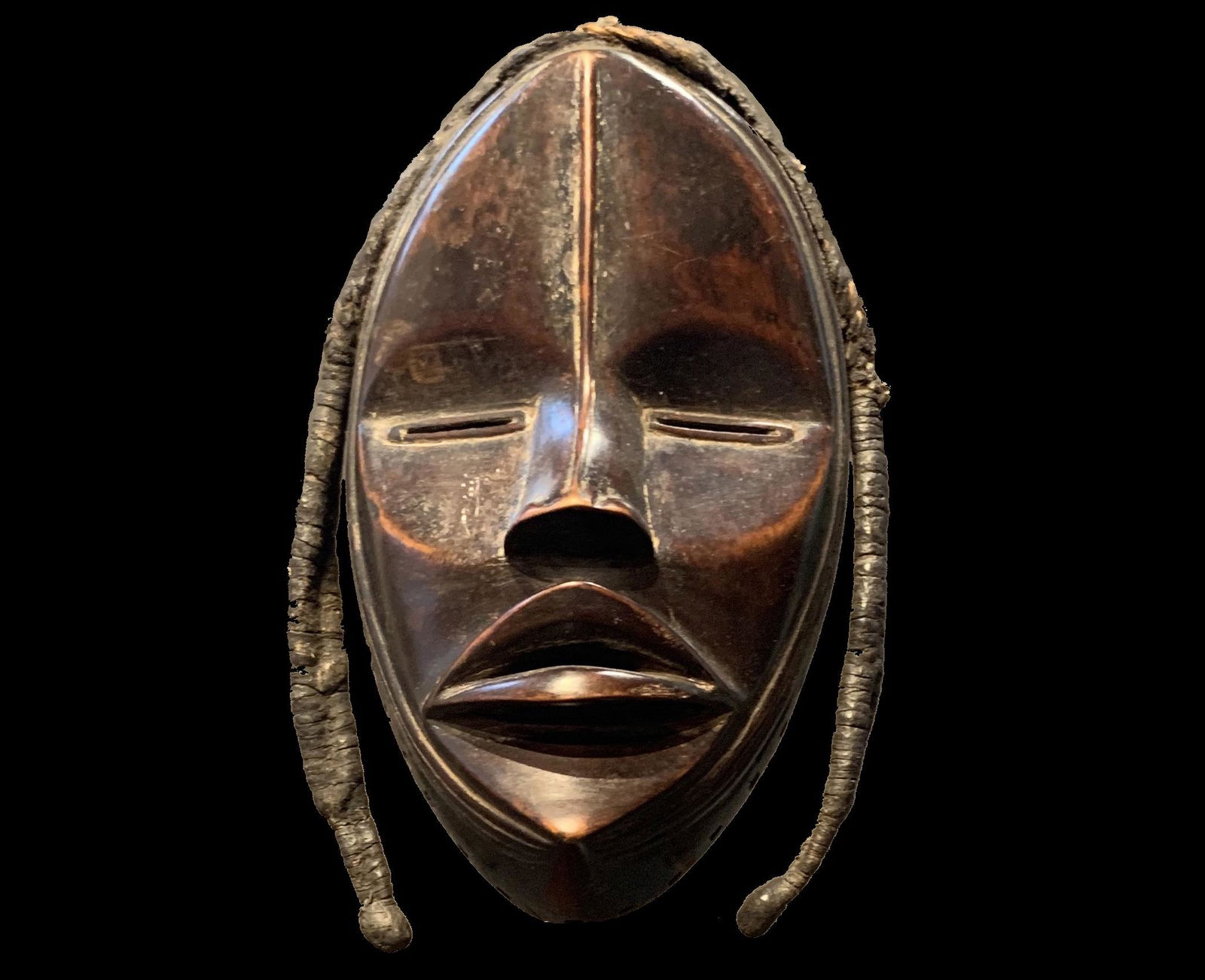 Dan Female Mask (Late 19th c.): Dan Female Mask (Late 19th c.), AfricanThis exquisite example of a Female Dan Mask has the classic high relief nose and mouth on an oval face. A fine ridge from the forehead to the tip of the nose acc