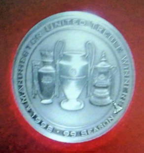 - Treble Coin in Display Case - The 1998/1999: Lot 72 - Treble Coin in Display Case - The 1998/1999 Season was the most successful season in the history of Manchester United Football Club. After finishing the previous season without winning any