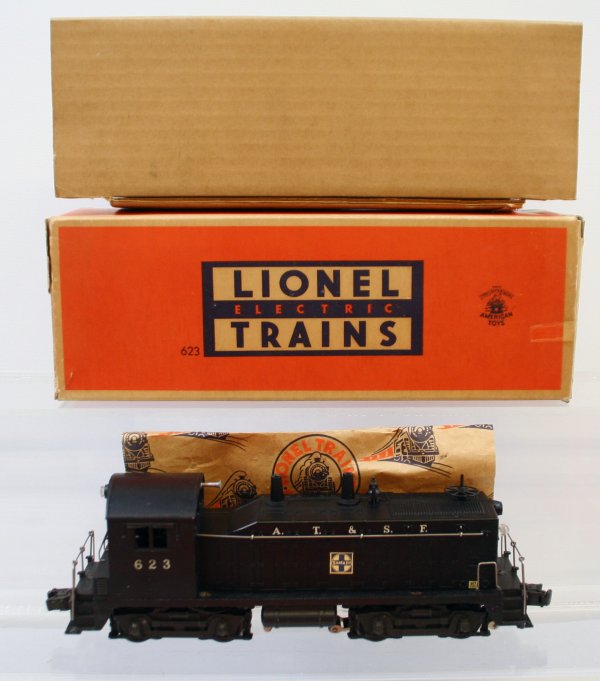 Lionel 623 Sante Fe Switcher Like New in Box: Lionel "O" Gauge: 623 Santa Fe (A.T. & S.F.) Diesel Switcher Locomotive. This is in Like New condition. Box has some minor wear, box has the original cardboard liner and the original Lionel paper line