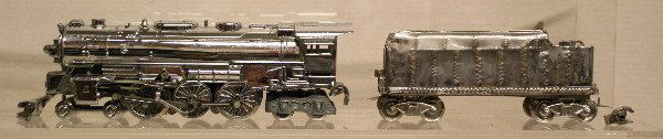 Lionel 2055 Chrome Plated Engine & Tender: Lionel O Scale: 2055 Locomotive 4-6-4 & Tender. Cow catcher broken off, coupler broken off. Good condition, no boxes. Box:n