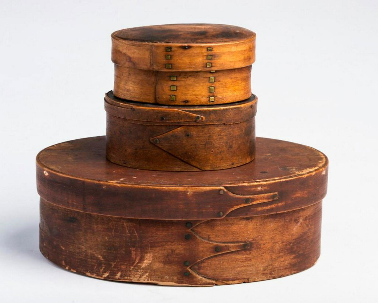 Three Finger Jointed Pantry Boxes.: The largest, length 10 inches, width 6 1/2 inches, height 3 1/2 inches. The next, length 5 1/4 inches, width 3 7/8 inches, height 2 1/4 inches. The last, with unusual brass nails, length 5 inches, wid