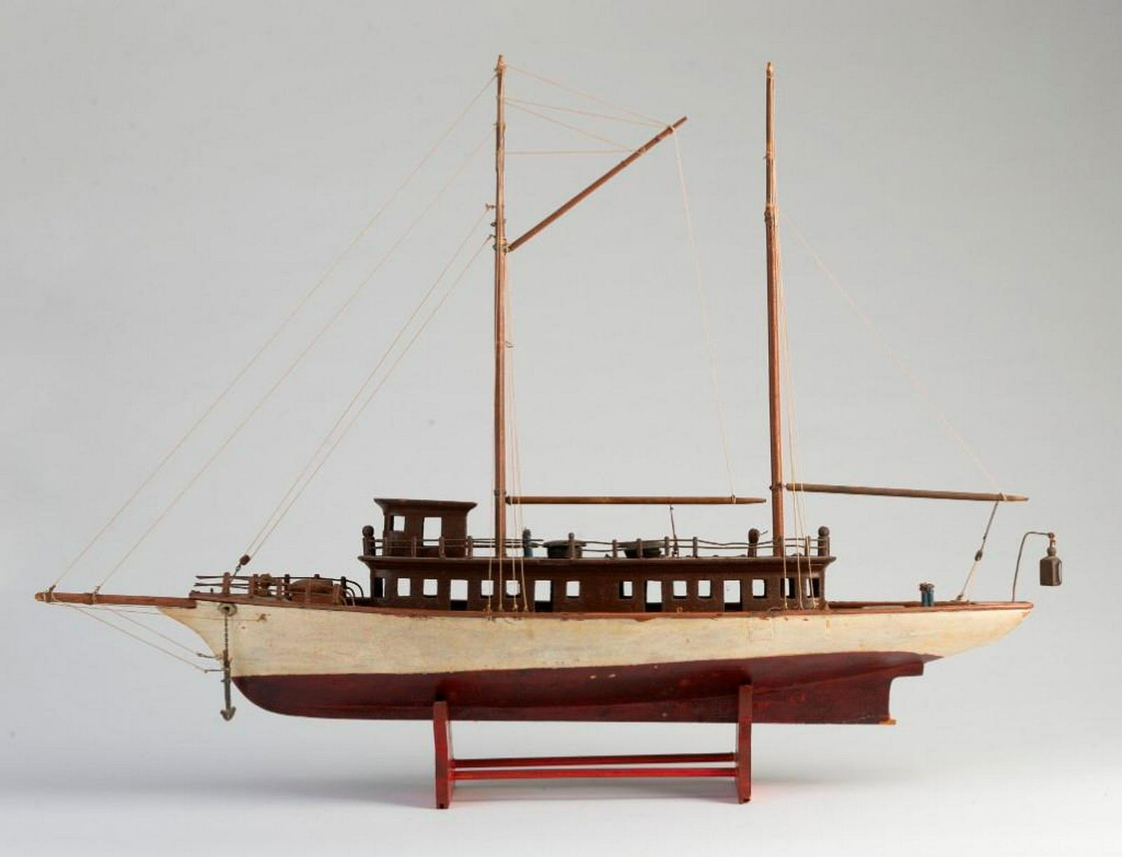 Model of a Two Masted Commuter Vessel.: With red and white painted hull, and brown painted cabin. Length 28 1/2 inches, height 21 inches.
