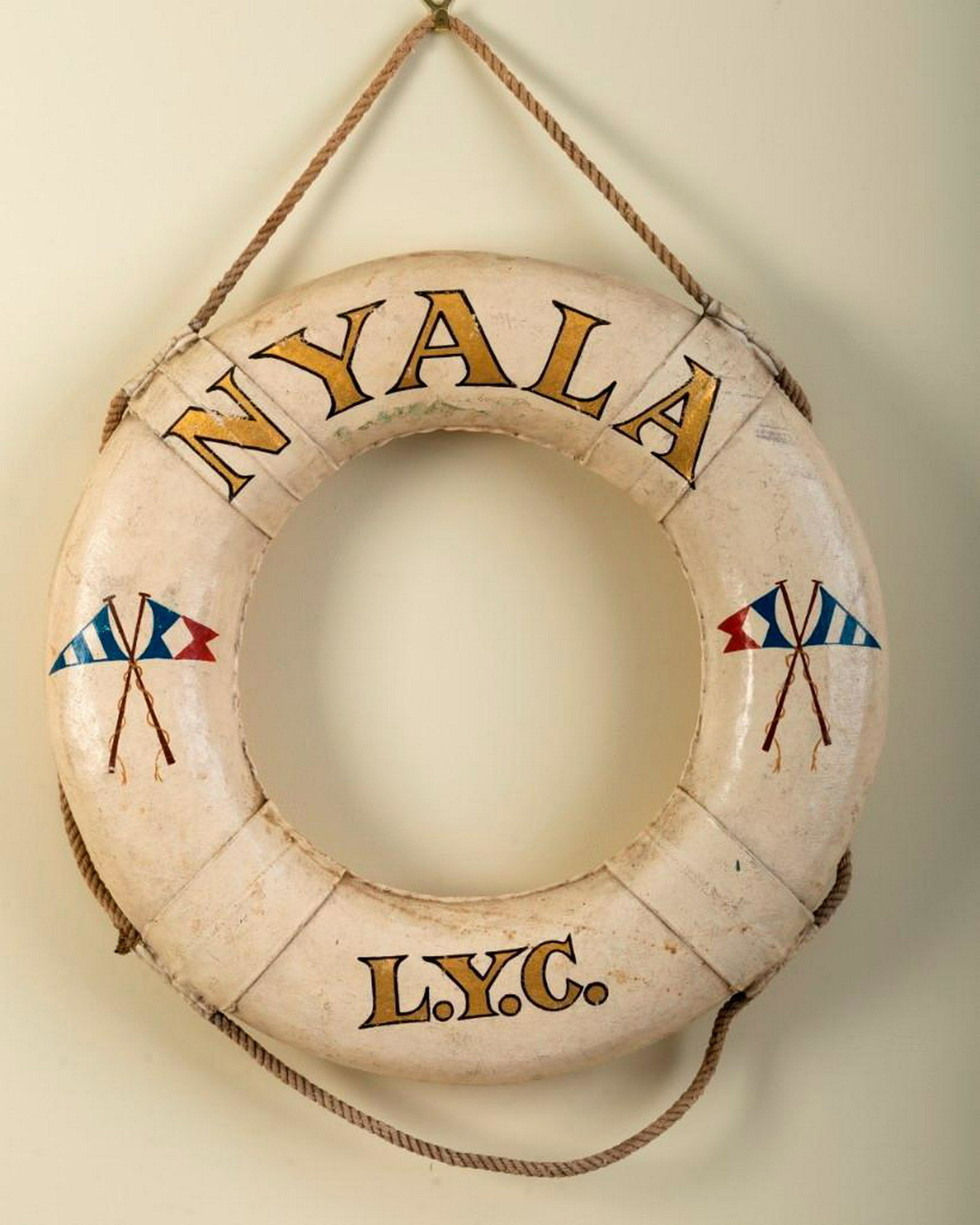 Life Saving Ring From the Yacht NYALA.: Printed "NYALA L.Y.C." with two sets of signal flags. Diameter 21 inches.