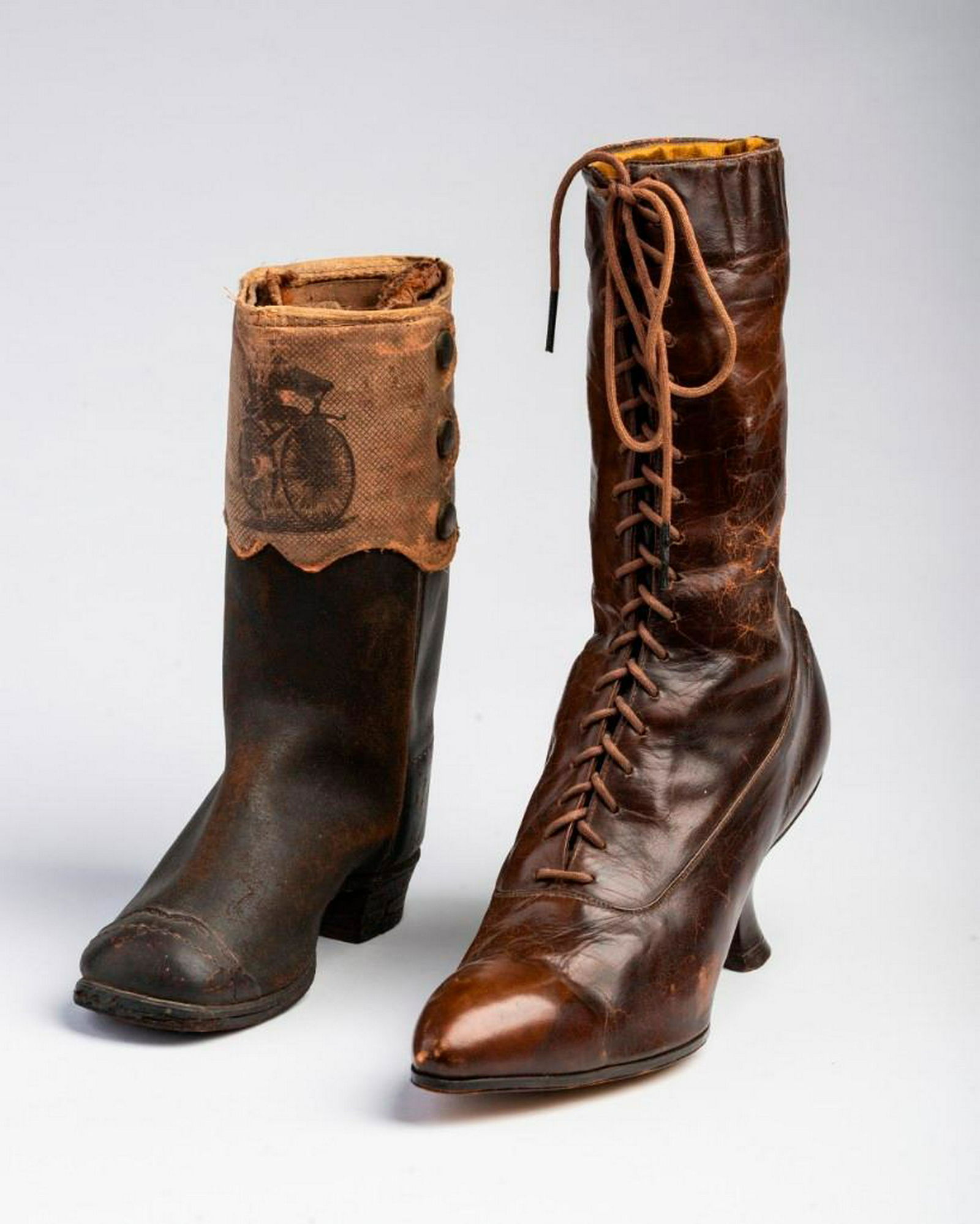 Two Antique Boots: The first with decoration of a bicycle, height 8 1/2 inches.