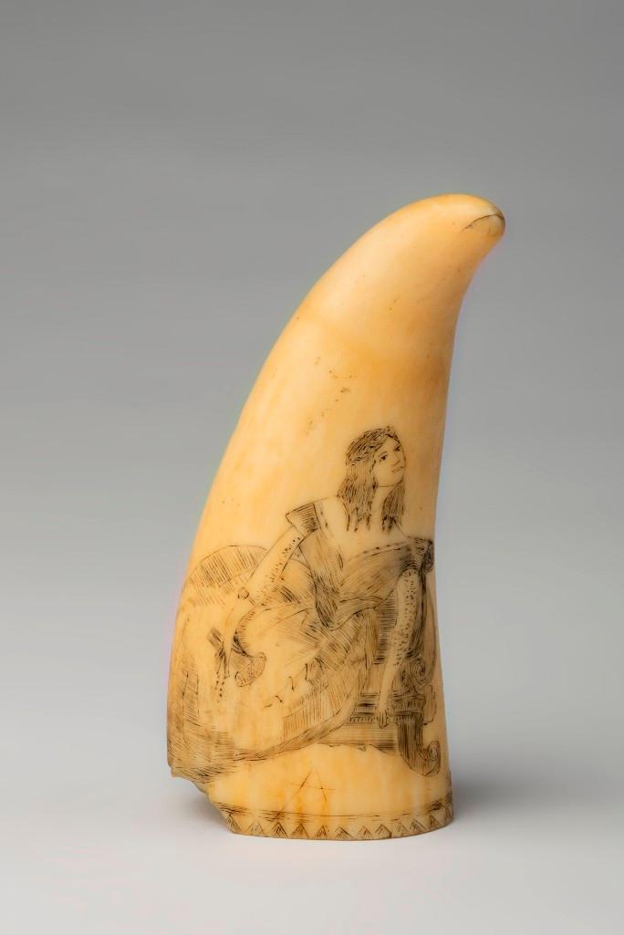 Scrimshaw Whale's Tooth, Early to Mid-Nineteenth C.: Engraved on one side with a view of a lady resting on a recamier, her hair in ringlets, a locket bracelet on her arm and holding a hair comb and ribbon in her hand, and on the other side with a cavali