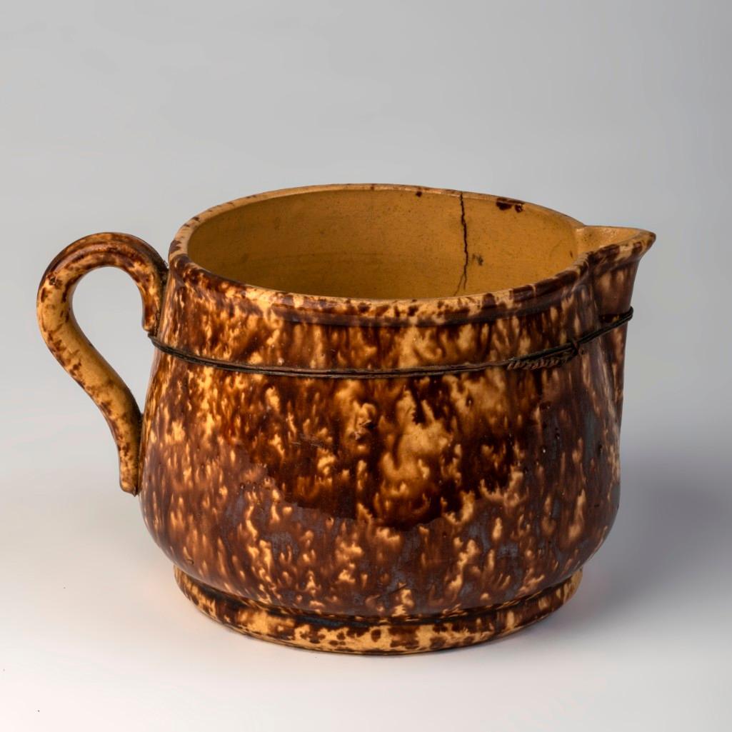 Yellow Ware Pitcher in Rockingham Glaze. (1 of 2)