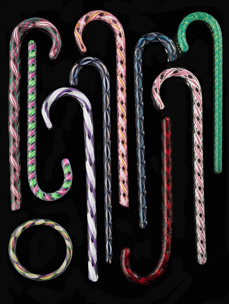 Nine Blown Glass Candy Cane Ornaments.: Together with a blown glass ring. Length of longest, 7 1/2 inches.