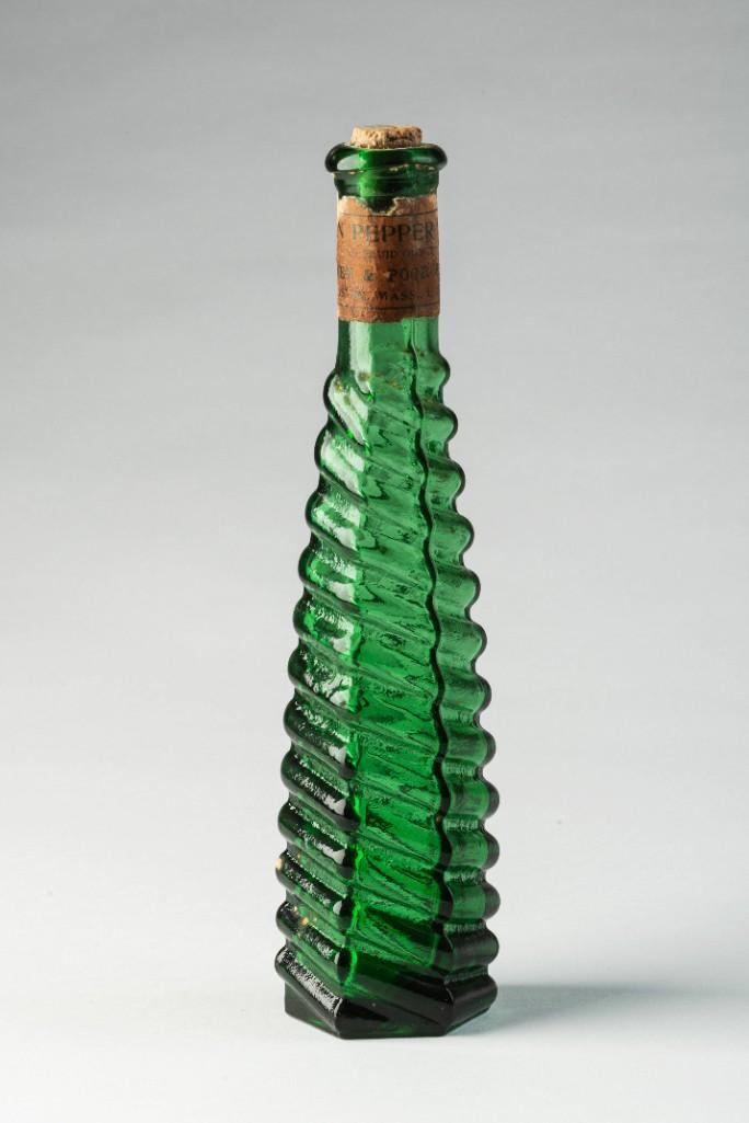 Stickney & Poor Spice Co. Emerald Green Bottle.: With remnants of original paper label and cork, of spiral design. Height 8 inches.