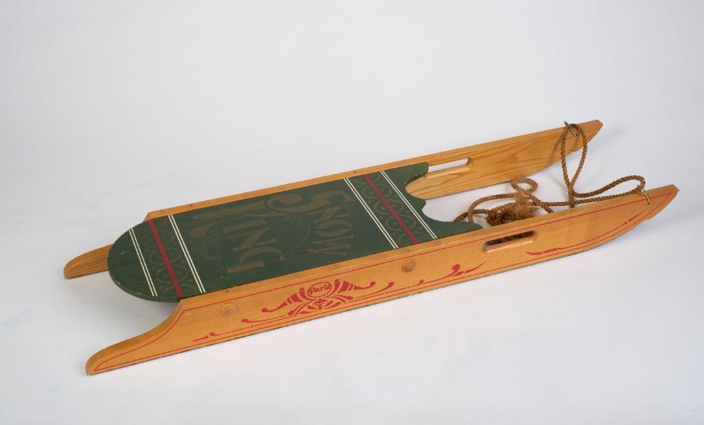 Paris Mfg. Co. Snow King Sled.: In green paint, with stenciled decoration. Length 40 inches.