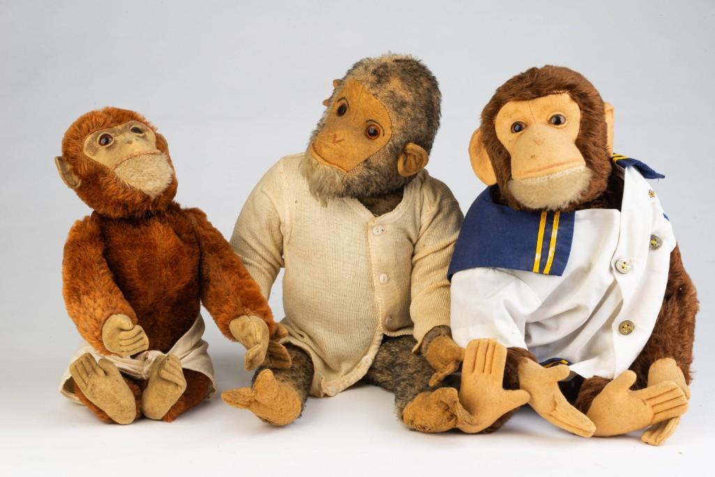 Three Vintage Toy Monkeys.: Each with articulated limbs and swivel head. Height of tallest 11 inches.