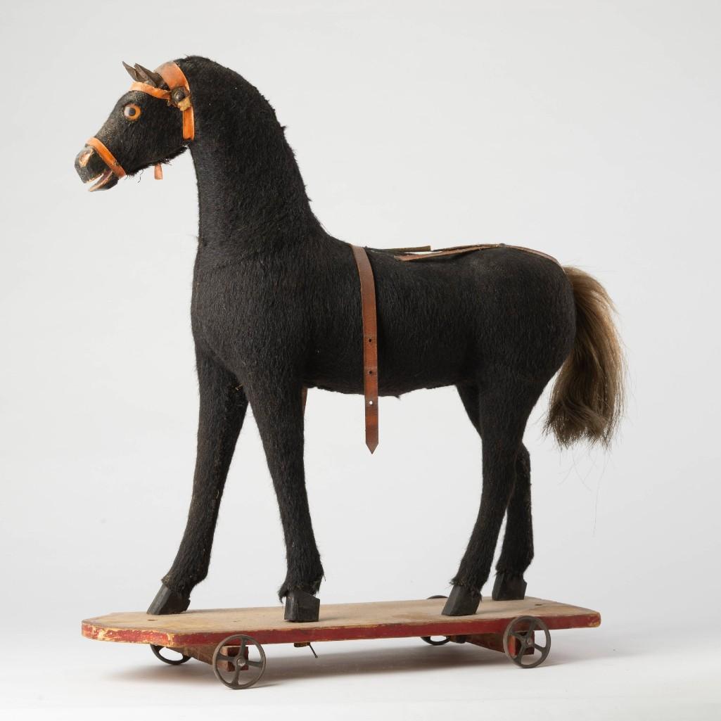 Large Horse Pull Toy.: With glass eyes, height 23 inches, base 19 x 6 1/2 inches.