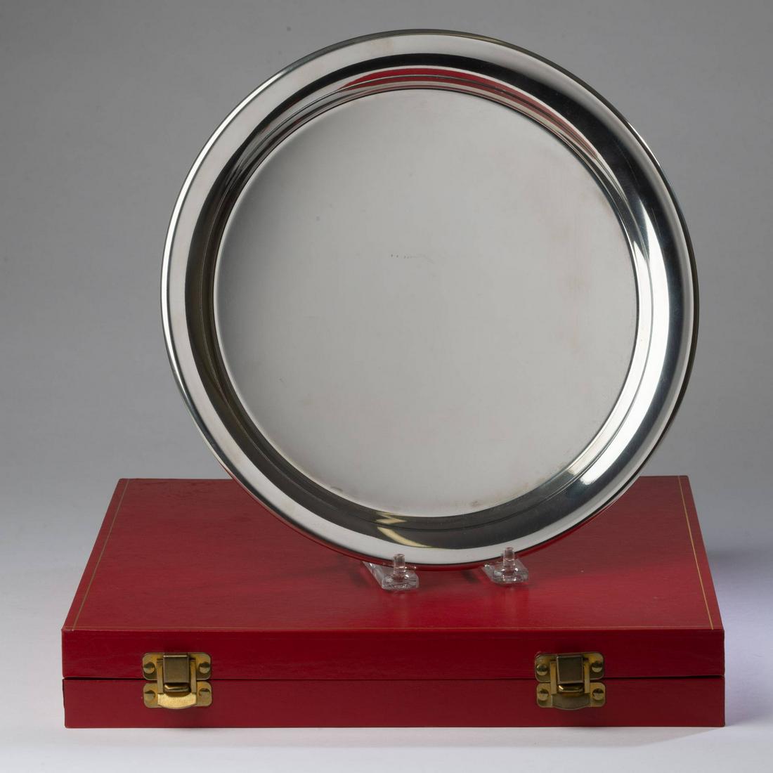 Cartier Silverplate Tray in Original Box.: Diameter 11 inches. READY TO BE ENGRAVED. Items may be previewed at our Freeport, Maine gallery prior to the close of the auction. Call 207-370-4746 or e-mail andrew@cascobayauctions.com to schedule a