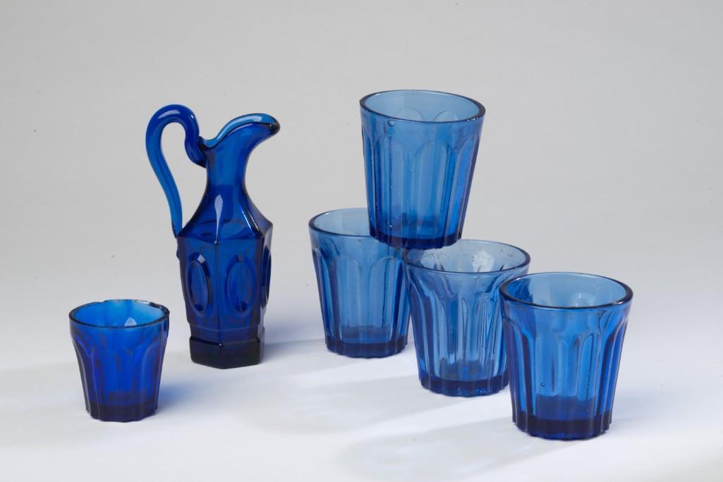 Group of Cobalt Blue Miniature Glassware.: Including four shot glasses, heights 2 1/4 inches, smaller glass, height 1 5/8 inches, and a pitcher, height 4 1/2 inches.