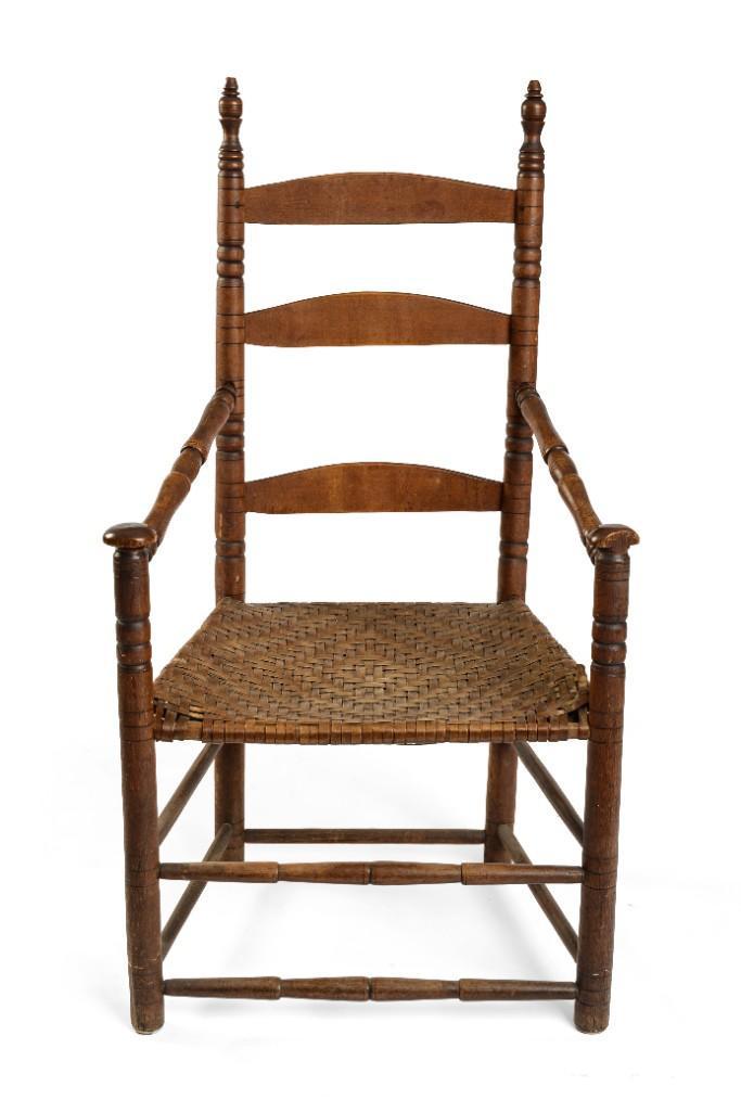 Early American Ladderback Armchair.: With sausage turned stiles, mushroom hand grips, and ball finials. With maker's name H.W. Morse on the back of the central splat. Height 43 1/2 inches.