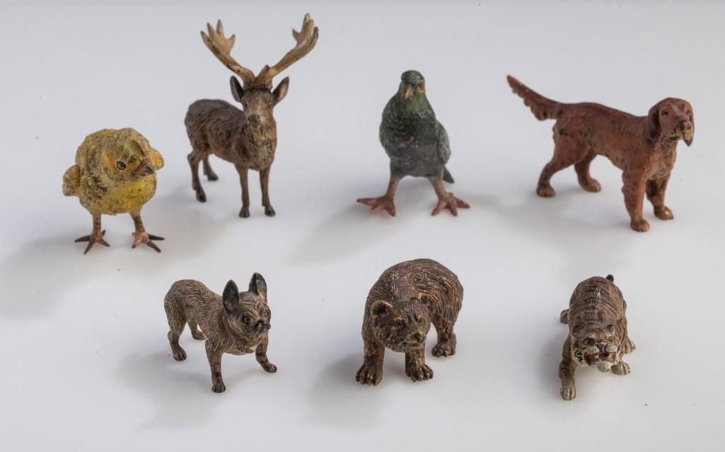 Menagerie of MIniature Cold Painted Bronze Animals.: Seven total, including a chick, elk, parrot, Irish setter, bull dog, bear and tiger. Height of elk 2 inches.
