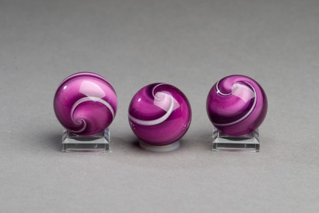 Three Hamon Marbles.: Contemporary marbles by Robert Hamon, dated 1997. Diameters 1 1/8 inches.