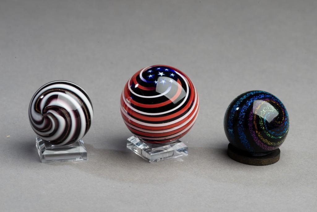 Three Contemporary Marbles.: Diameters 1 1/4 to 1 1/2 inches.