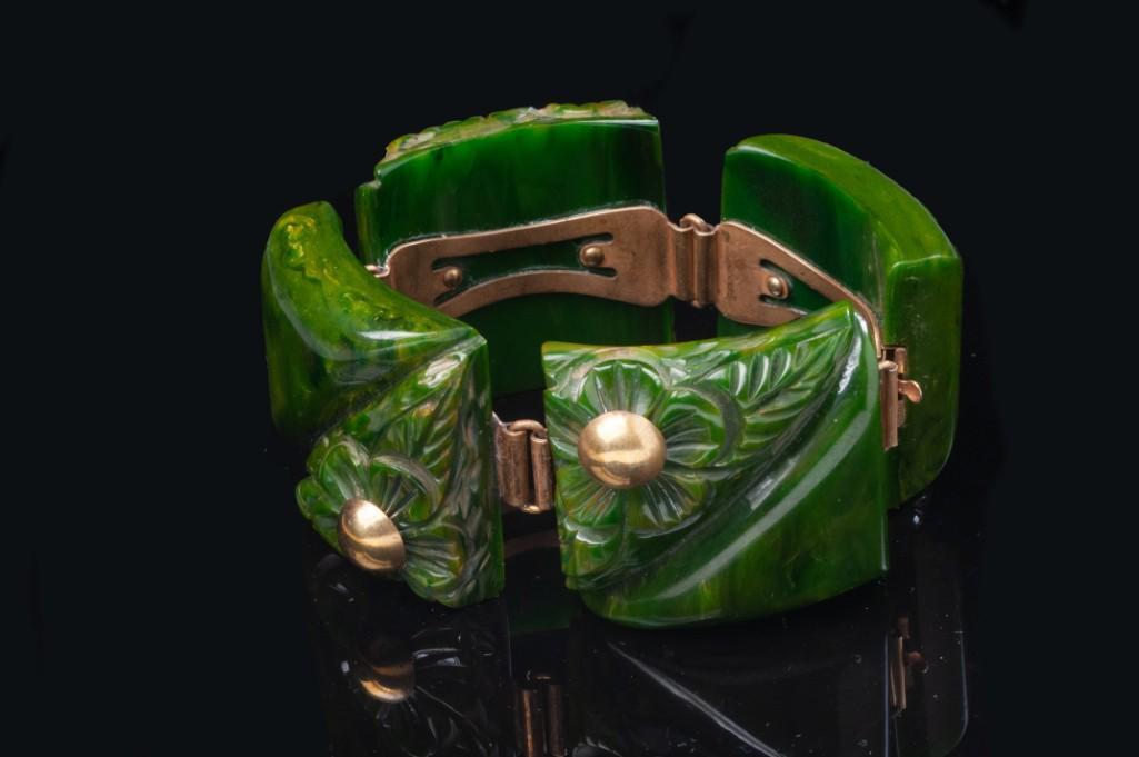 Green Bakelite Bracelet: With applied metal decoration, inside diameter 2 1/4 inches. Detailed condition reports are available upon request. Due to the current stay at home order, in-person preview will not be available until
