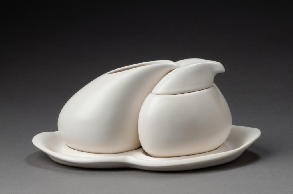 Peter Saenger Nesting Creamer and Sugar: With a matching tray, height 4 inches. Signed on base. Detailed condition reports are available upon request. Due to the current stay at home order, in-person preview will not be available until May 1