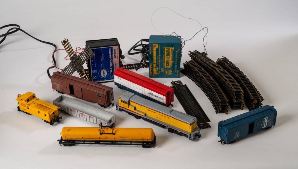 HO Gauge Train Set.: Including Union Pacific 2802 locomotive, five cars, two transformers, and sections of track. Untested for operation. Detailed condition reports are available upon request. Due to the current stay at h