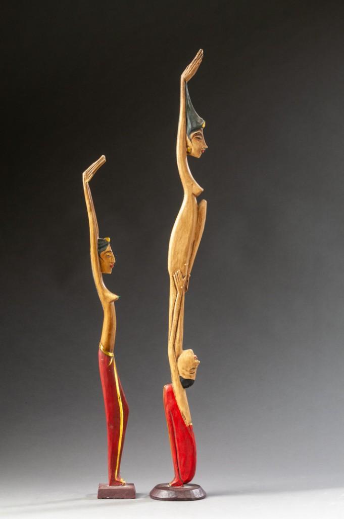 Two Indonesian Carved Figures.: Heights 28 and 21 inches. Detailed condition reports are available upon request. Due to the current stay at home order, in-person preview will not be available until May 1 Items may be picked up at ou