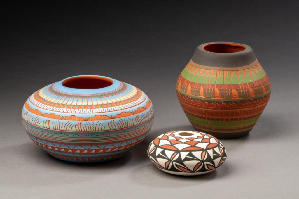 Three Native American Pottery Vases.: Two Navajo by Hilda Whitegoat and Dennison Billy, heights 3 1/2 and 4 3/4 inches, and an Acoma vase, height 1 3/4 inches.