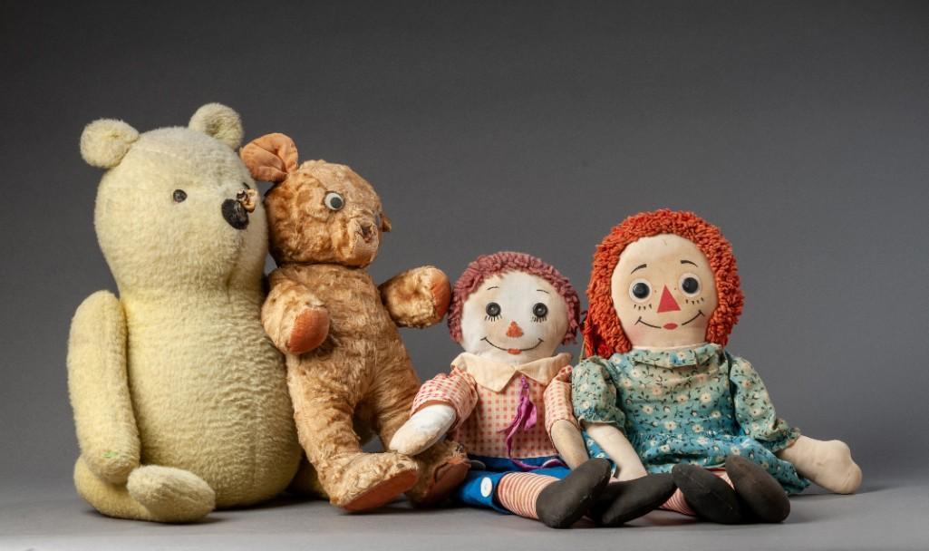 Group of Stuffed Dolls.: Raggedy Ann and Andy, heights 20 and 18 inches, a mohair bear, height 14 inches and Pooh, height 18 inches..