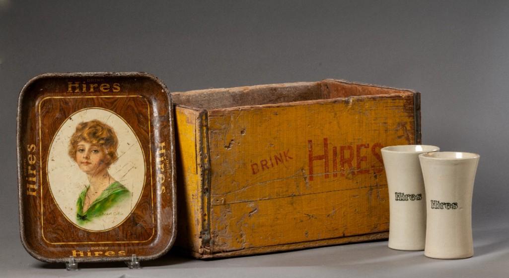 Group of Hires Root Beer Items: A crate, height 10 1/2 inches, length 18 inches, depth 12 inches. Two stoneware mugs, height 7 inches, one with chip to rim. And a tray, illustrated by Haskell Coffin, 13 1/4 x 10 3/4 inches.