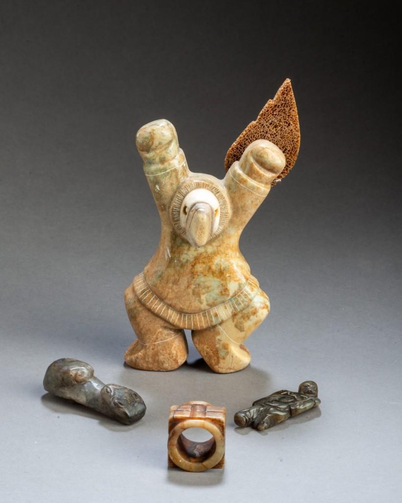 Four Inuit Stone Carvings.: Four total, including a dancing figure, height 6 1/4 inches, a ring, diameter 1 1/8 inches, and two other small figures.