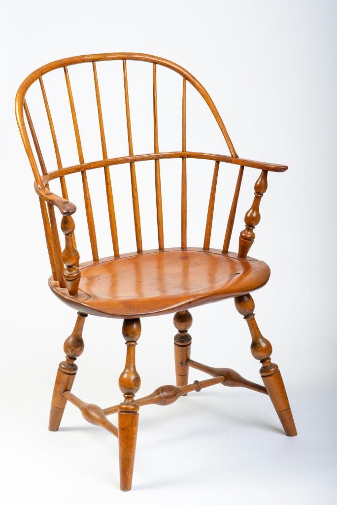 Bow Back Windsor Armchair.: Two spindles loose, feet ended out.