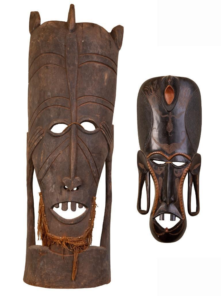 Two African Ceremonial Masks.: The first, height 48 inches, the second, height 24 inches. Provenance: purchased by Dr. John Dinan in Somalia.