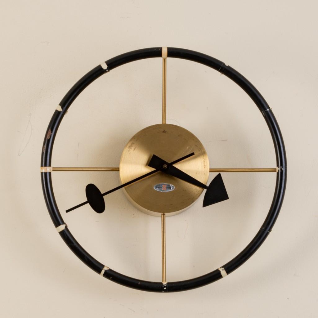 George Nelson for Howard Miller Wall Clock.: "Steering Wheel" design, diameter 11 1/2 inches. With original foil label. Small area of rust on outer rim.