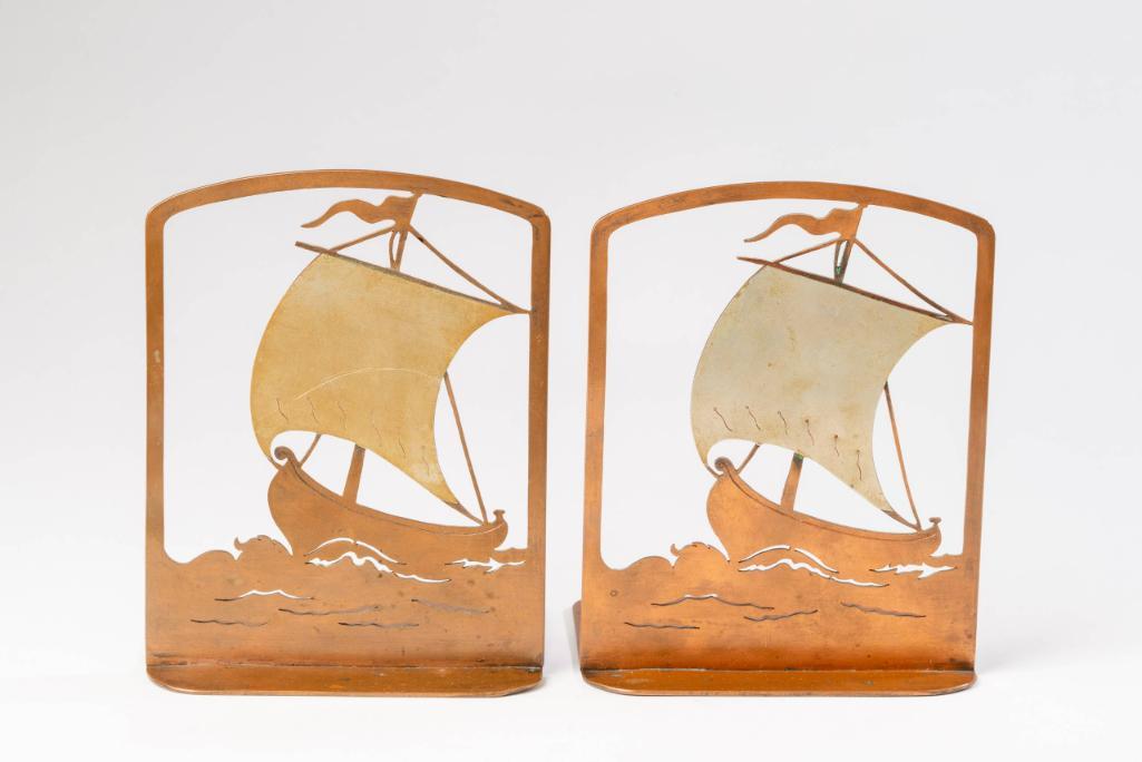 Pair of Arts and crafts Metal Viking Ship Bookends: Signed with a monogram, 1920's, height 6.5 inches.