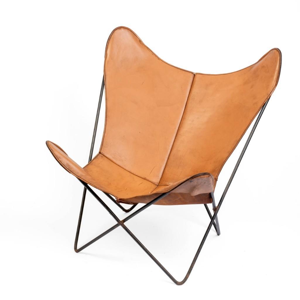 Early Knoll Butterfly Chair With Leather Sling Seat.: Hardoy, Bonet and Kurchan Design. Height 34.5 inches, width 32.5 inches, depth 28 inches.